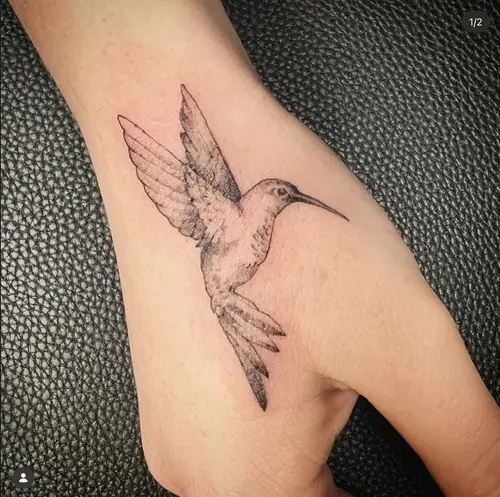 Fine-line hummingbird hand tattoo by Maiku — WA Tattoo Las Vegas