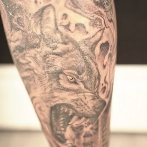Black and grey wolf forearm tattoo by Maiku — WA Tattoo Las Vegas
