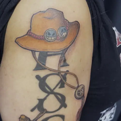 One Piece Ace hat color anime tattoo by Maiku — WA Tattoo Las Vegas